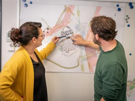 Two MACK Solutions employees working on a model during the planning stage.