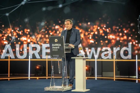 Michael Mack gives a speech at the AUREA Awards.